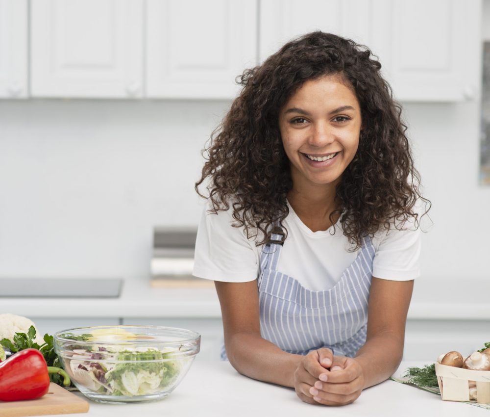 smiling-afro-american-woman-posing-vegetables